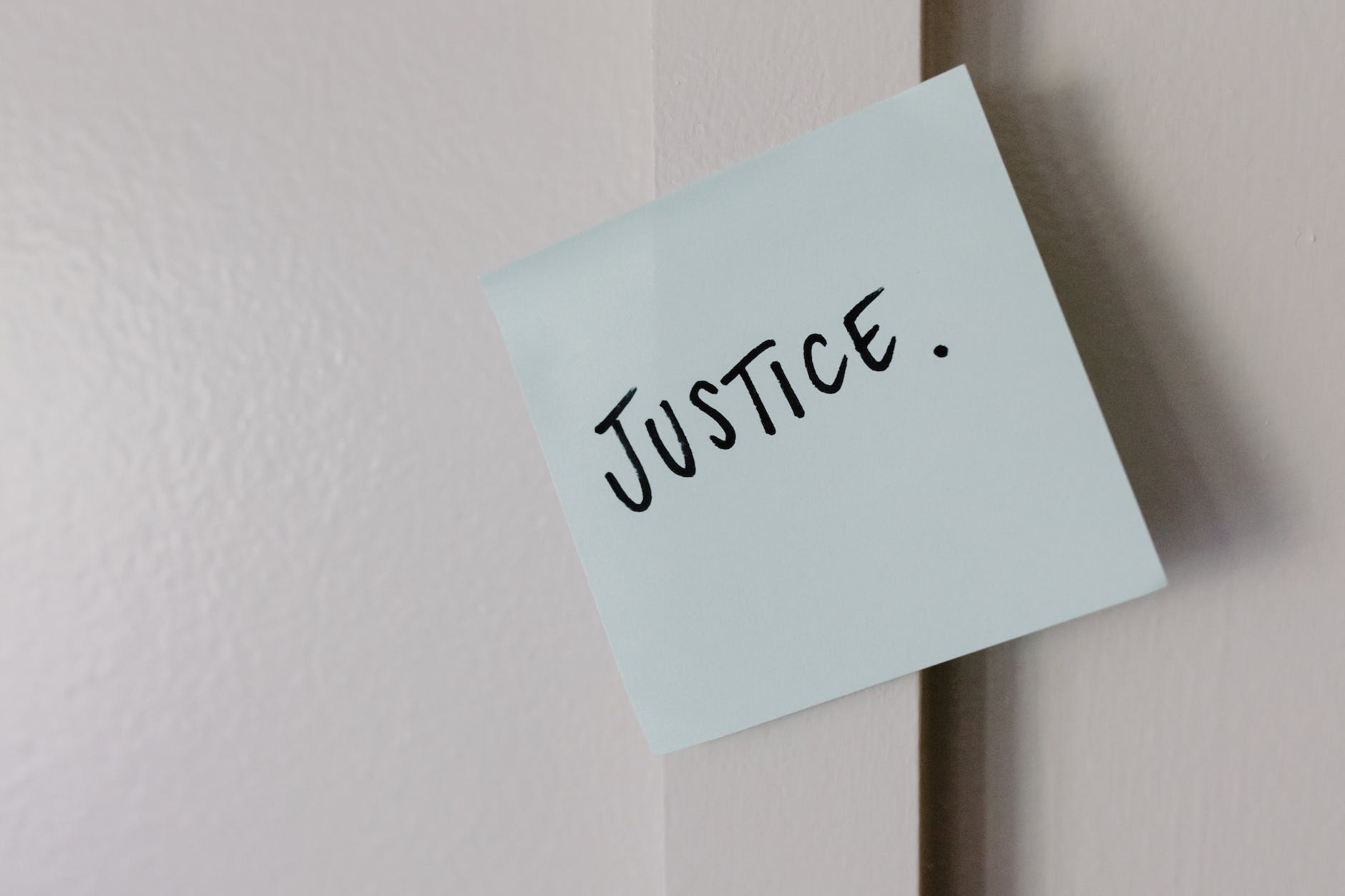 the word justice written on paper